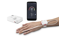 Hand wearing Safetynet Alert, phone displaying safetynet alert app, and safetynet alert home medical hub